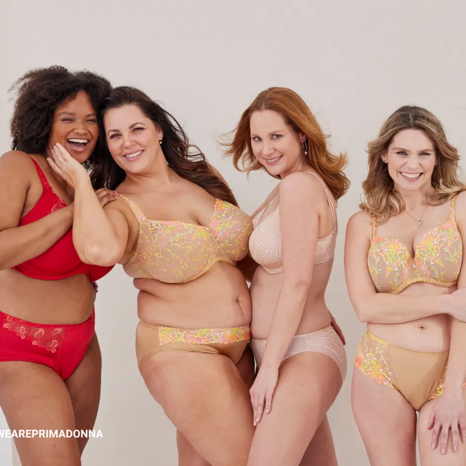 Four women wearing bras