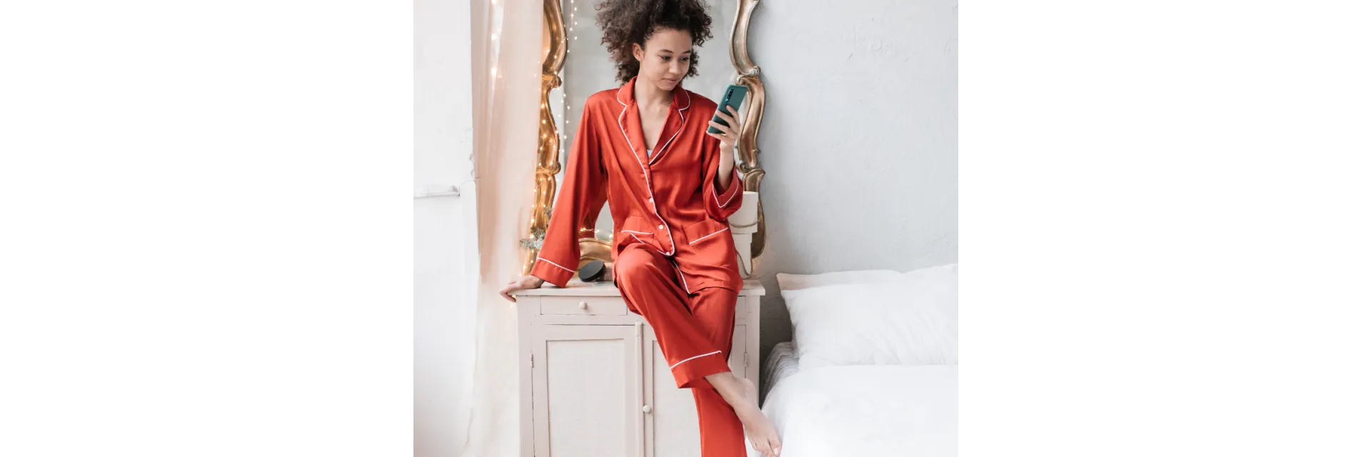 Woman in red robe with curly hair