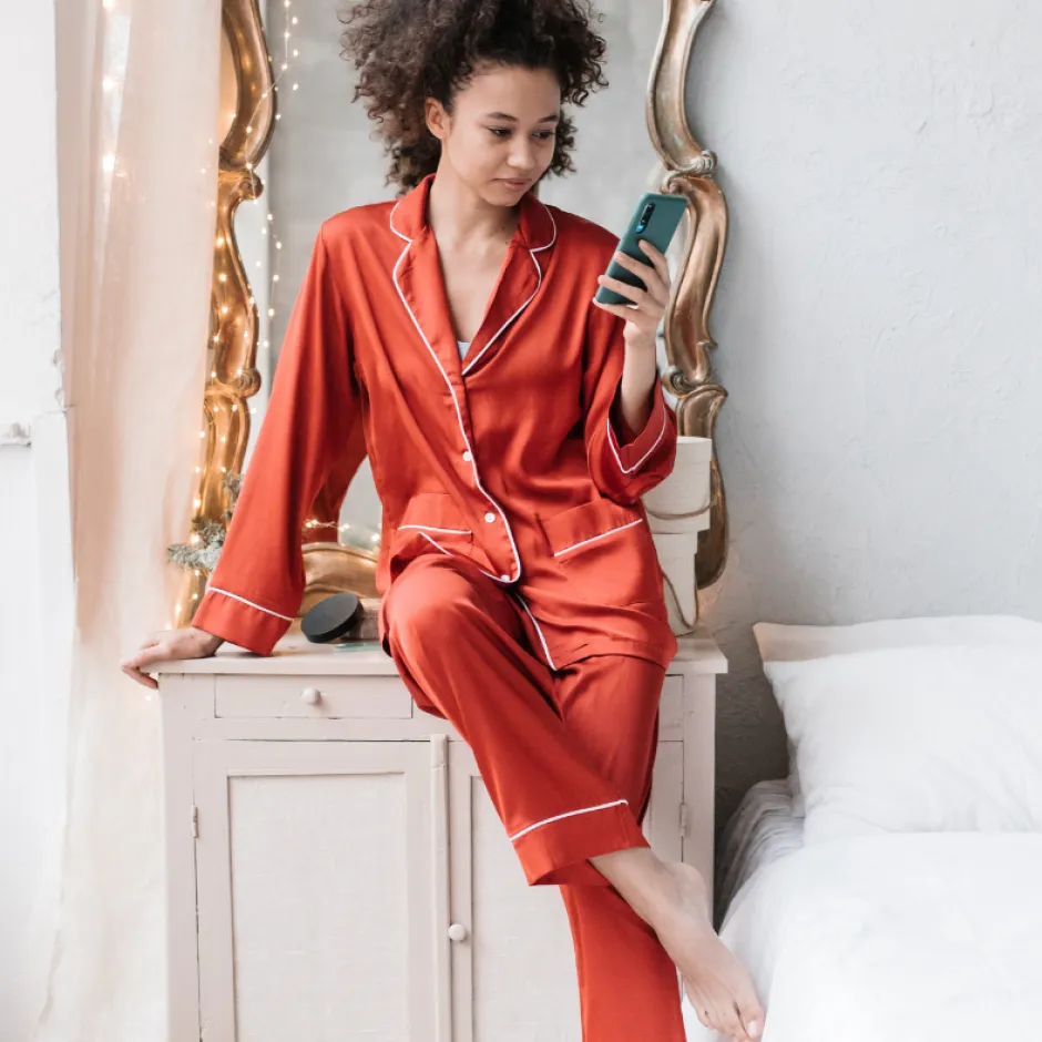 Woman in red robe with curly hair